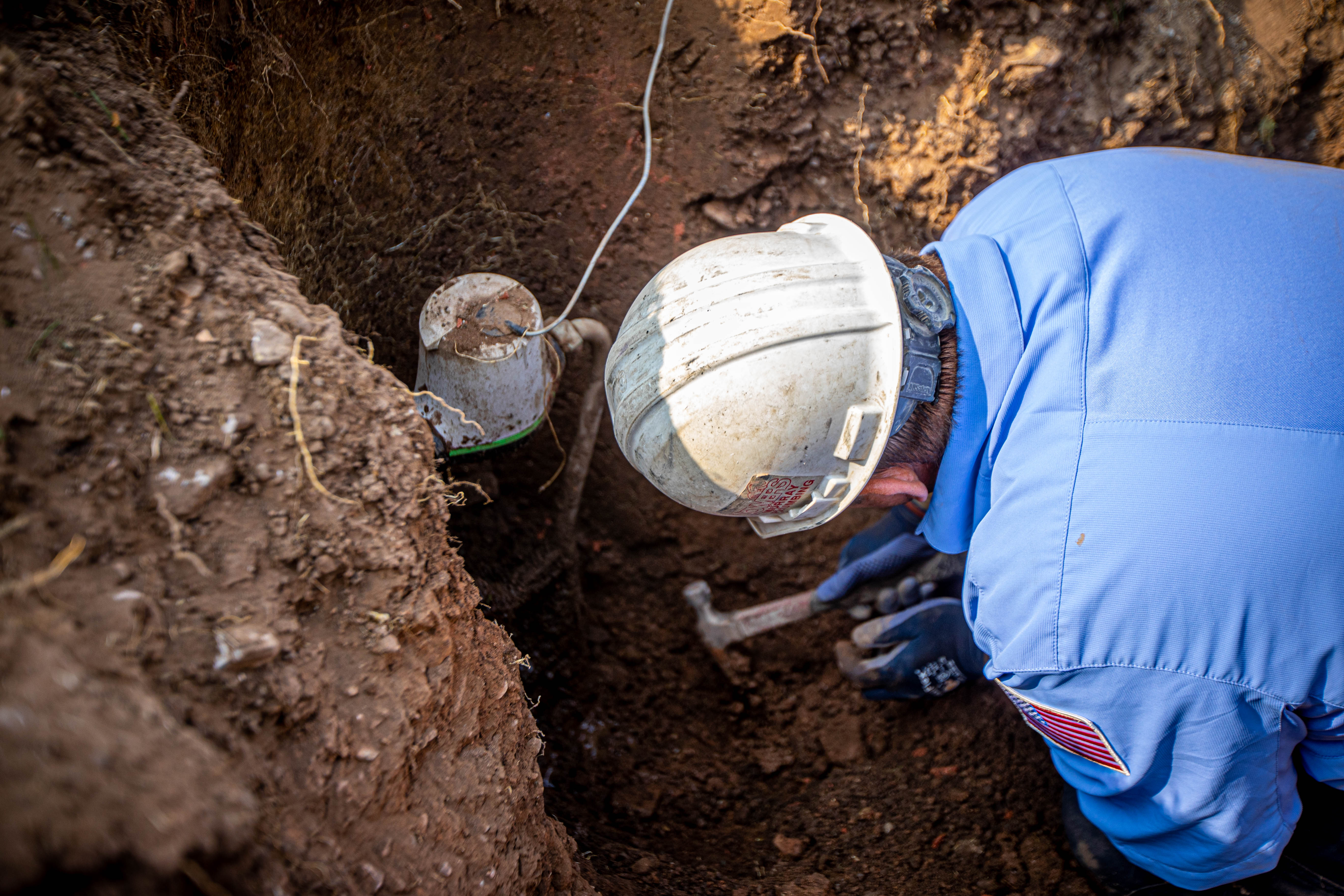 Towers Plumbing technician locating a main water line leak at a Northern Utah home