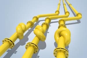 Yellow plumbing pipes tied in knots